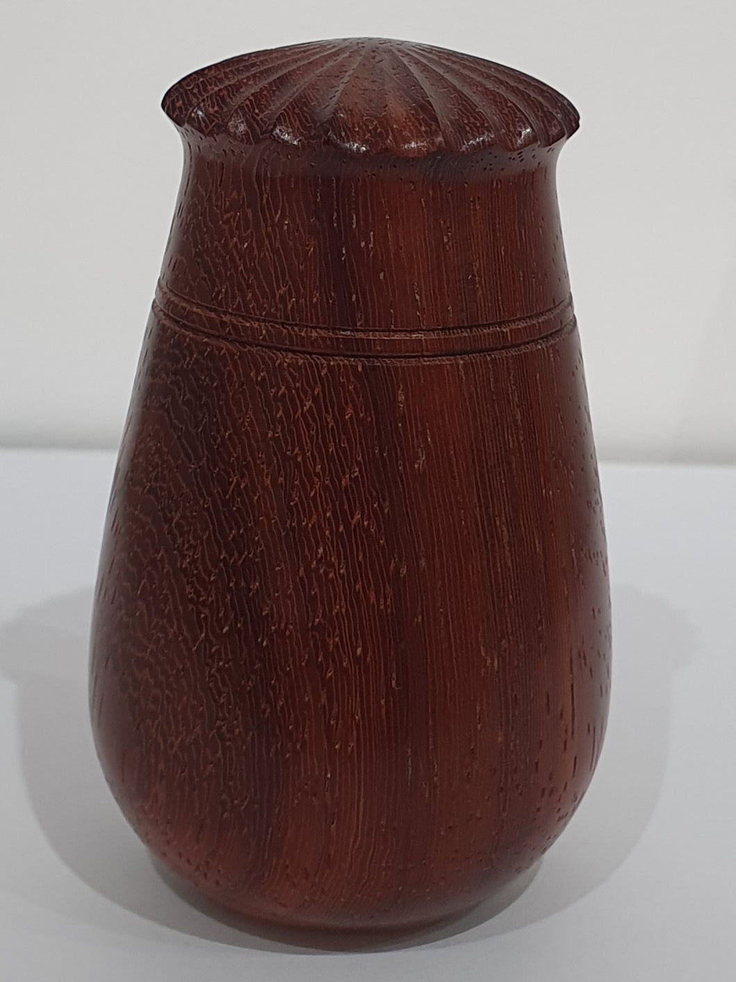 Padquk pot with poppy seed head lid.